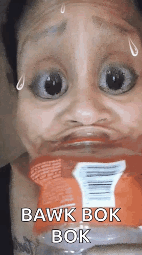 A Woman Is Making A Funny Face With A Bottle Of Soda In The Background . GIF