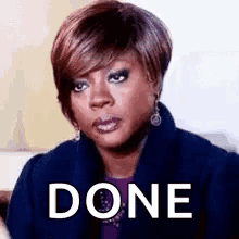 A Woman Is Making A Funny Face With The Word Done Written On Her Face . GIF