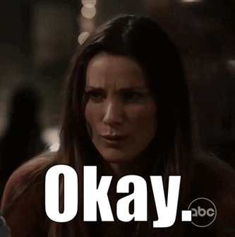 A Woman Is Making A Funny Face With The Words Okay Written On Her Face GIF