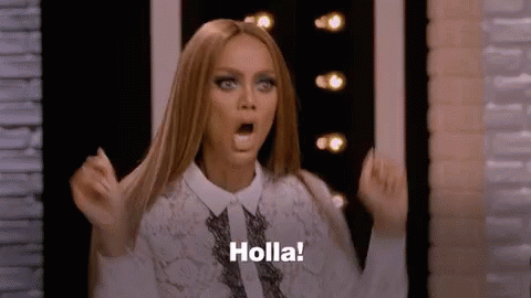 A Woman Is Making A Surprised Face And Saying Holla ! GIF
