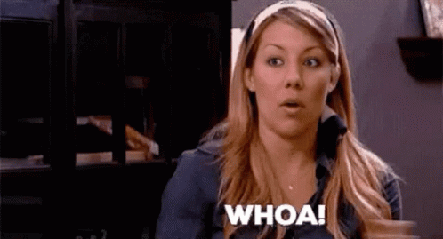 A Woman Is Making A Surprised Face And Saying Whoa ! GIF