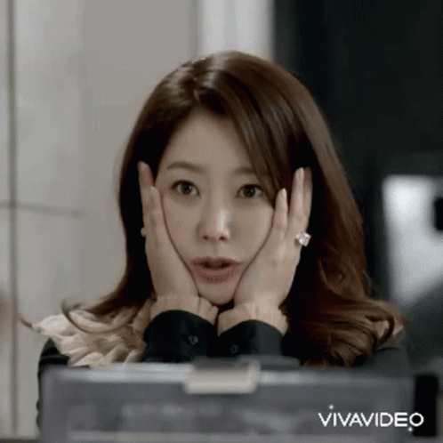 A Woman Is Making A Surprised Face With Her Hands On Her Face And The Words Vivavideo Behind Her GIF