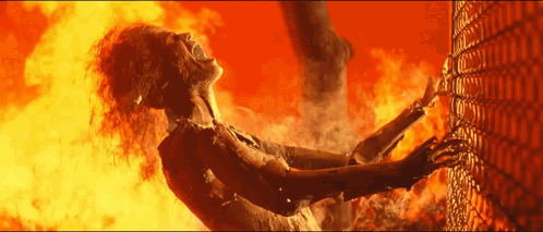 A Woman Is On Fire And Trying To Escape GIF