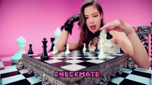 A Woman Is Playing A Game Of Chess With The Words Checkmate Above Her . GIF