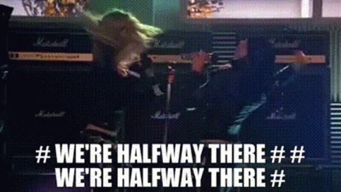 A Woman Is Playing A Guitar And Singing Into A Microphone While Standing In Front Of A Marshall Amplifier . GIF