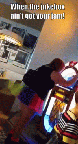 A Woman Is Playing A Jukebox With The Caption When The Jukebox Ain 'T Got Your Jam GIF