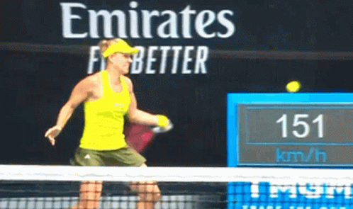 A Woman Is Playing Tennis In Front Of A Sign That Says Emirates Better GIF