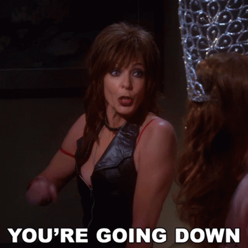 A Woman Is Pointing At Another Woman With The Words You 'Re Going Down Below Her GIF
