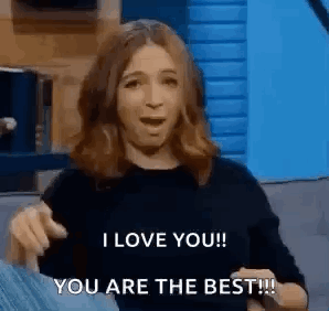 A Woman Is Pointing At The Camera And Saying `` I Love You ! You Are The Best !! '' GIF