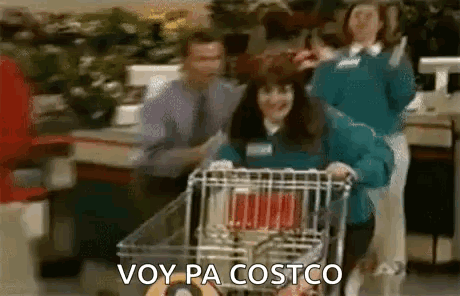 A Woman Is Pushing A Shopping Cart In A Grocery Store And Says `` Voy Pa Costco '' . GIF