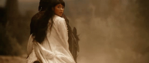 A Woman Is Riding On The Back Of A Horse . GIF