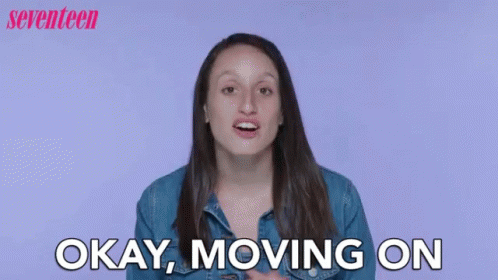 A Woman Is Saying Okay , Moving On In Front Of A Purple Background . GIF