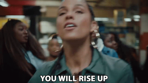 A Woman Is Saying `` You Will Rise Up '' In Front Of A Crowd . GIF