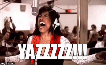 A Woman Is Screaming Into A Microphone While Wearing Headphones And A Red Shirt . GIF