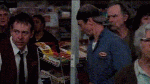 A Woman Is Screaming With Her Mouth Open GIF