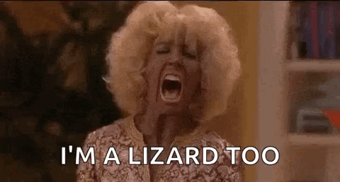 A Woman Is Screaming With Her Mouth Wide Open And The Words `` I 'M A Lizard Too '' . GIF