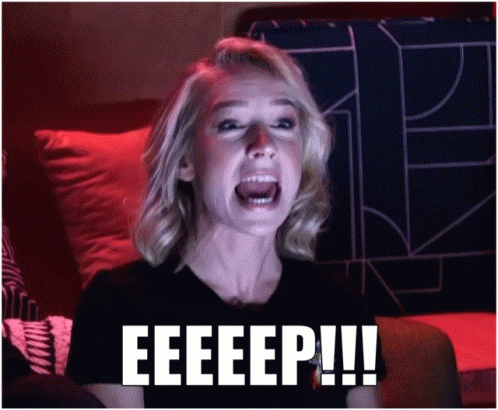 A Woman Is Screaming With The Word Eeeep Written On The Bottom Of Her Face GIF