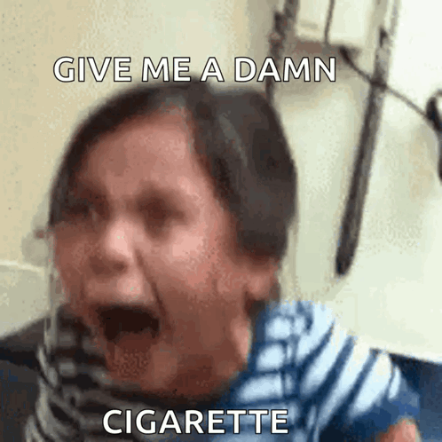A Woman Is Screaming With The Words Give Me A Damn Cigarette Written Above Her GIF