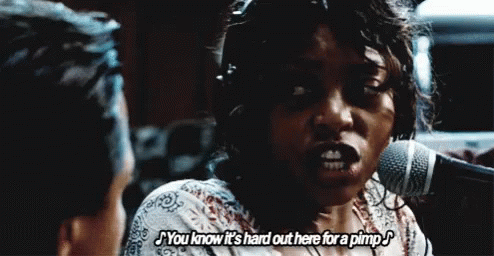 A Woman Is Singing Into A Microphone And Saying You Know It 'S Hard Out Here For A Pimp GIF
