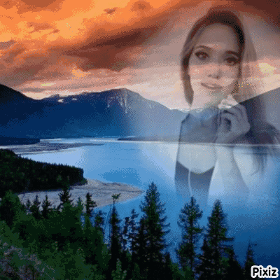 A Woman Is Singing Into A Microphone In Front Of A Lake . GIF