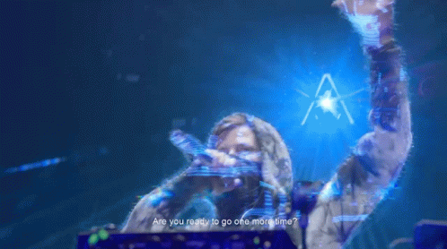 a woman is singing into a microphone with the words " are you ready to go one more time " above her