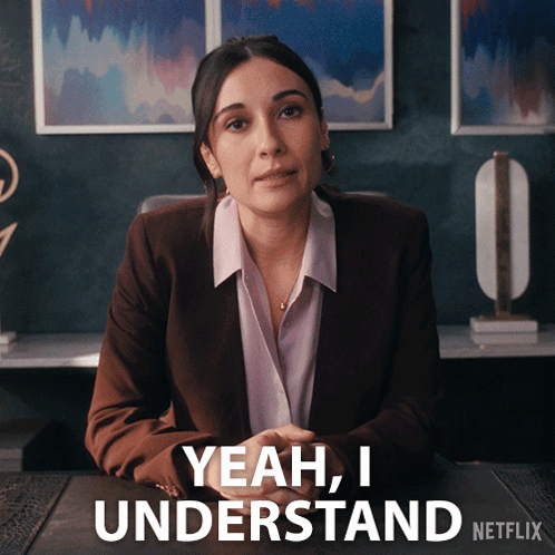 A Woman Is Sitting At A Desk And Says Yeah I Understand Netflix GIF