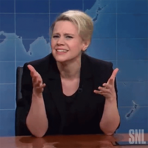 A Woman Is Sitting At A Desk With Her Arms Outstretched In Front Of A Map On The Wall . GIF