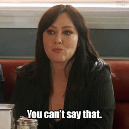 A Woman Is Sitting At A Table And Says You Can 'T Say That GIF