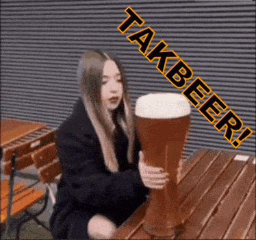 A Woman Is Sitting At A Table Holding A Large Glass Of Beer With The Words Takbeer Written Above Her GIF