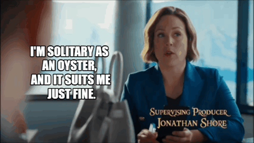 A Woman Is Sitting At A Table With A Caption That Says " I 'M Solitary As An Oyster " GIF