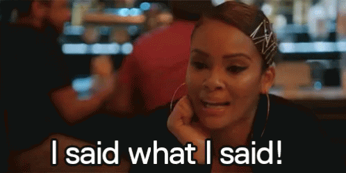 A Woman Is Sitting At A Table With Her Hand On Her Chin And Says `` I Said What I Said ! '' GIF
