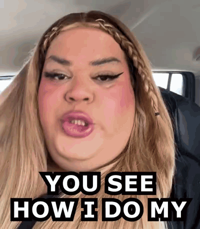a woman is sitting in a car with her mouth open and says `` you see how i do my '' .