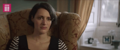 A Woman Is Sitting In A Chair With A Bbc Logo On The Bottom Right GIF