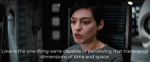 A Woman Is Sitting In A Chair With A Quote That Says Love Is The One Thing We 'Re Capable Of Perceiving GIF