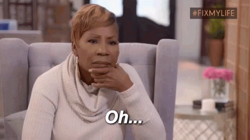 A Woman Is Sitting In A Chair With Her Hand On Her Chin And Says `` Oh '' . GIF