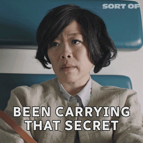 A Woman Is Sitting In A Chair With The Words Been Carrying That Secret Behind Her GIF