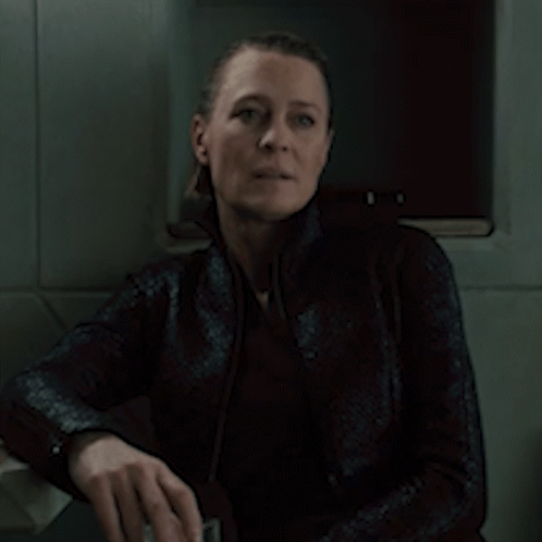 A Woman Is Sitting In A Dark Room And Says It 'S A Good One GIF