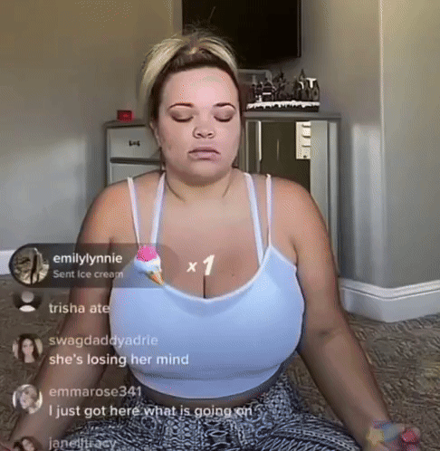 A Woman Is Sitting In A Lotus Position With Her Eyes Closed GIF
