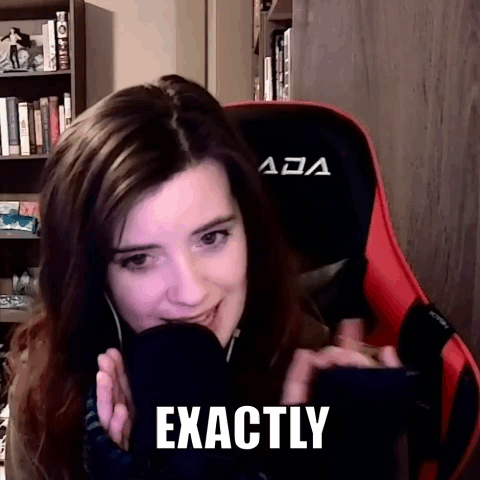 A Woman Is Sitting In A Red And Black Chair With The Word Exactly On Her Face GIF