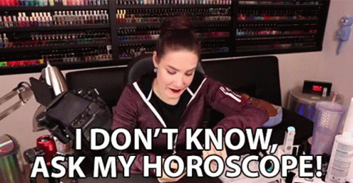 A Woman Is Sitting In Front Of A Camera With The Words I Don 'T Know Ask My Horoscope . GIF