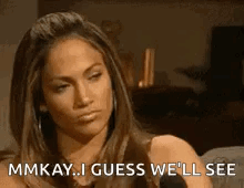 A Woman Is Sitting In Front Of A Microphone And Saying `` Mmkay ... I Guess We 'Ll See '' GIF