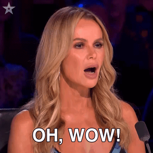 A Woman Is Sitting In Front Of A Microphone And Saying Oh Wow GIF