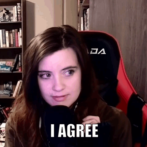A Woman Is Sitting In Front Of A Microphone With The Words I Agree On Her Face . GIF