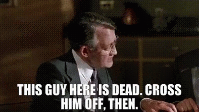 A Woman Is Sitting In Front Of A Painting With The Words `` This Guy Here Is Dead , Cross Him Off , Then . GIF