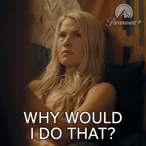 A Woman Is Sitting In Front Of A Paramount Sign GIF