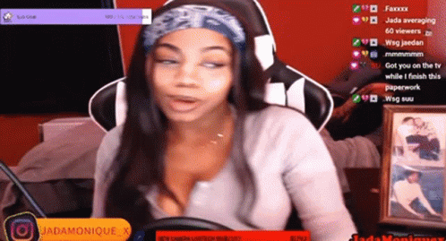 A Woman Is Sitting In Front Of A Screen That Says Jada Monique GIF
