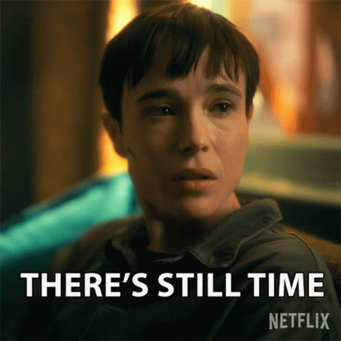 A Woman Is Sitting In Front Of A Sign That Says There 'S Still Time On It GIF