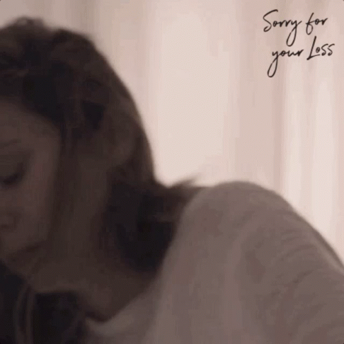 A Woman Is Sitting In Front Of A Window With Her Eyes Closed And The Words `` Sorry For Your Love '' Written On It . GIF