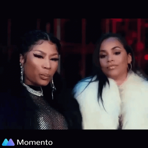 A Woman Is Sitting In The Back Seat Of A Car While Another Woman Looks On . GIF