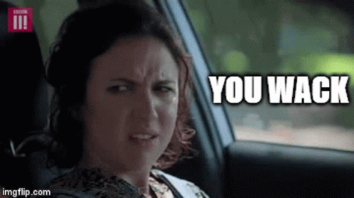A Woman Is Sitting In The Back Seat Of A Car With The Words You Wack Above Her . GIF